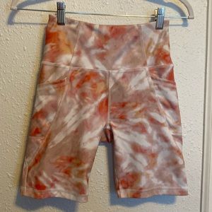 tie dye biker shorts in sherbet pink and orange colors